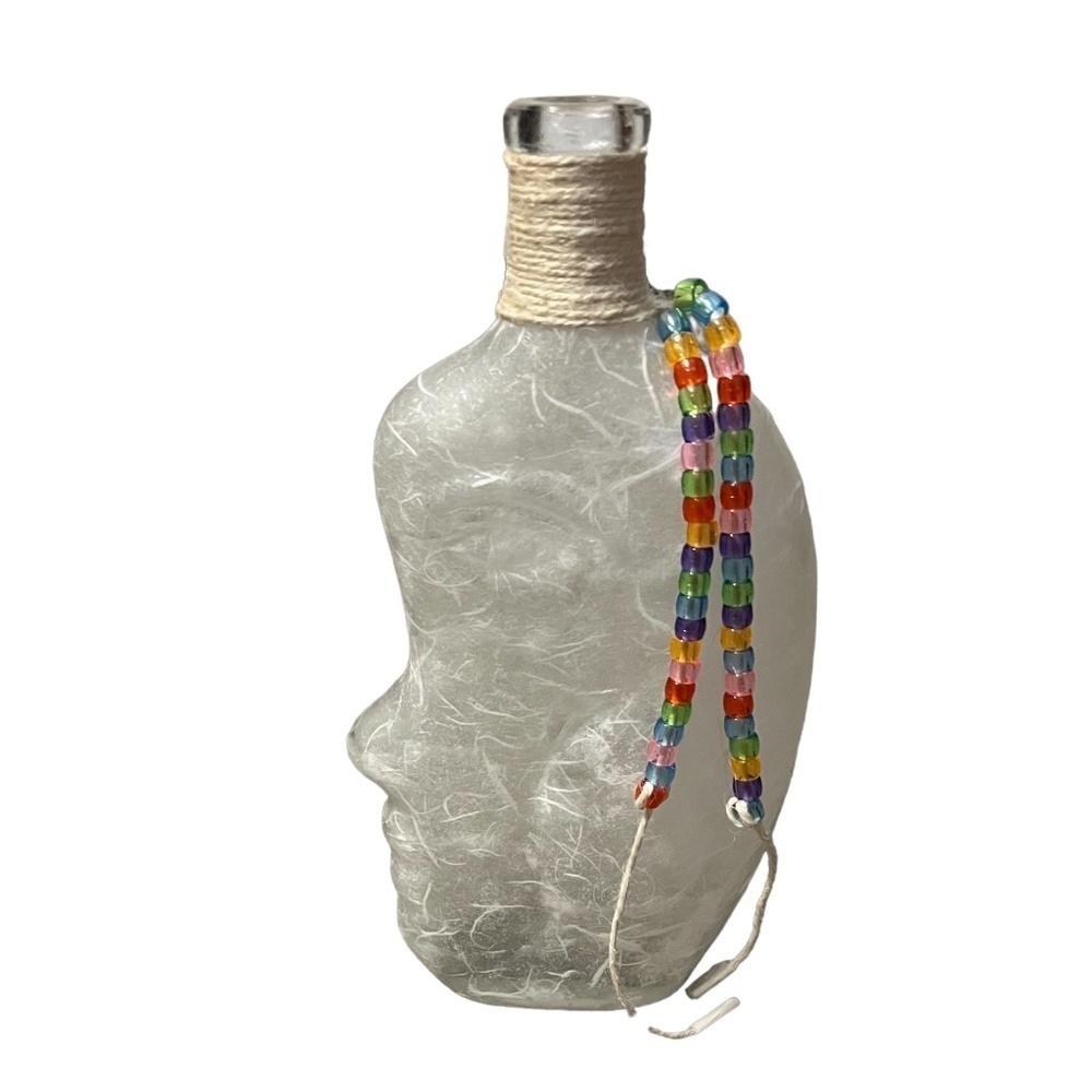 NWOT Glass bottle Face art paper mache with beads Strings, White